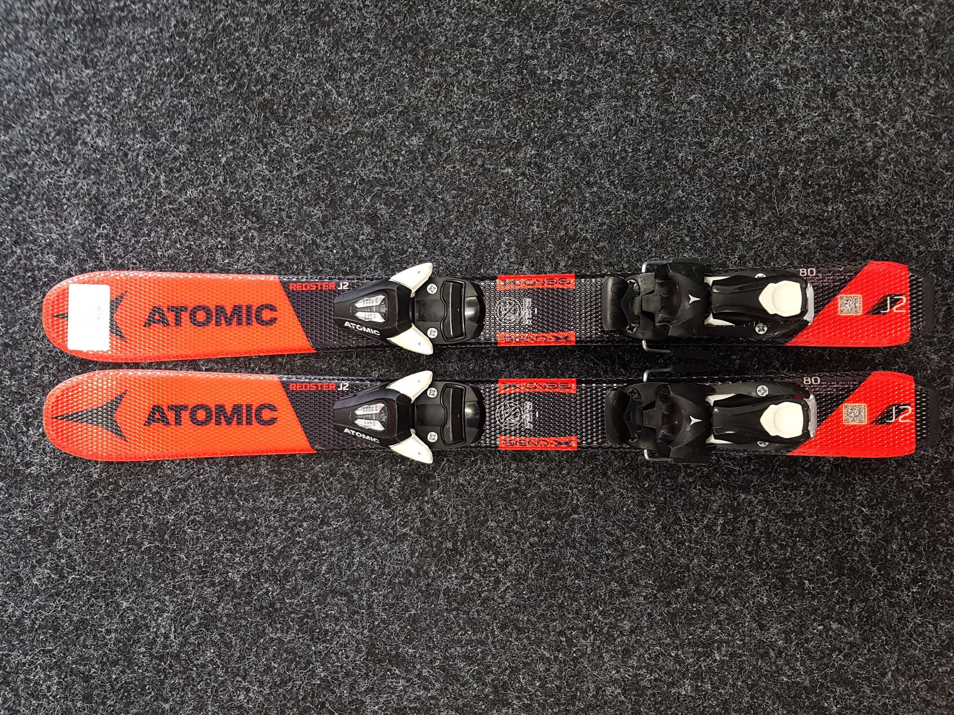 Použité detské lyže ATOMIC Redster J2 + viazanie Atomic C5